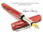 Plume empreinte bois de rose et platine et texte pour le site